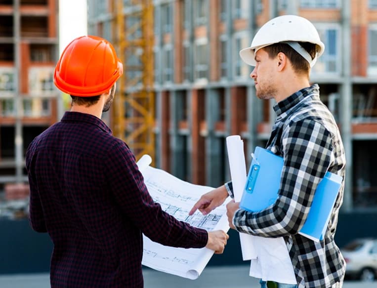 Professional engineers and construction team discussing building materials project in Saudi Arabia Professional engineers and construction team discussing building materials project in Saudi Arabia